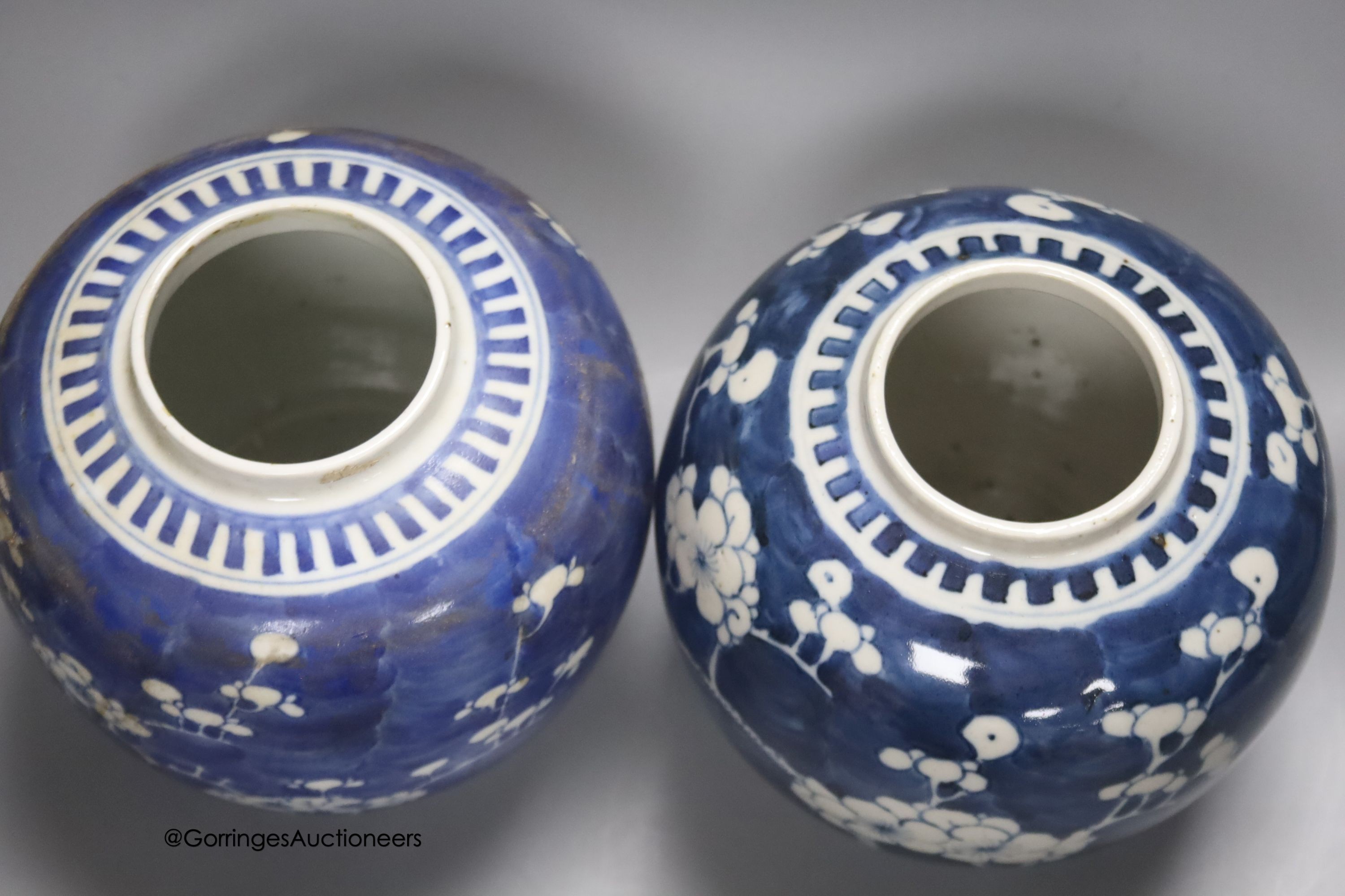 Two early 20th century Chinese blue and white prunus jars, tallest 16cm